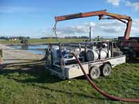 Pumping out and returning effluent to farm.